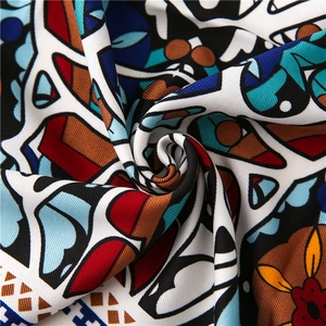 Vibrant bohemian abstract print fabric with twill texture and elegant drape effect