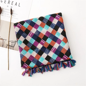 Close-up of checkered cotton linen scarf with colorful plaid pattern and fringe tassels