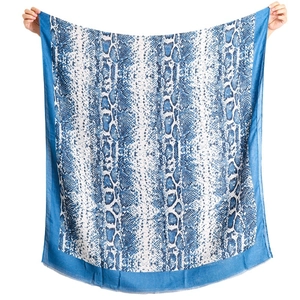Blue and white snakeskin print square scarf with frayed edges held by hands on white background