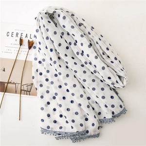 Lightweight white scarf with blue polka dots and delicate lace crochet edge trimming