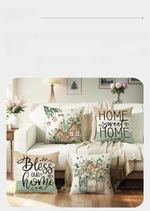 Detail of four floral cushion covers with Home Sweet Home text on a white sofa