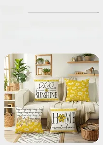Detail of daisy floral print cushion covers with natural texture on a modern sofa