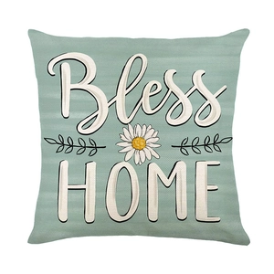 Daisy print decorative pillow cover with Bless HOME text in mint green polyester fabric