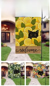 Close-up of double-sided garden flags with lemon cat patterns and welcome text detail