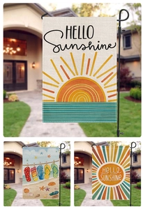 Three assorted summer garden flags featuring Hello Sunshine and beach flip-flop designs