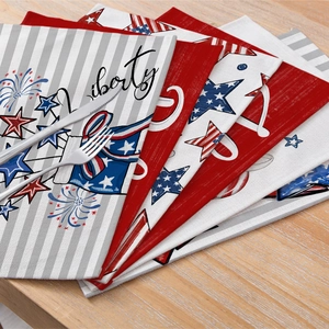 Independence Day polyester table placemats with stars and Liberty print on wooden table