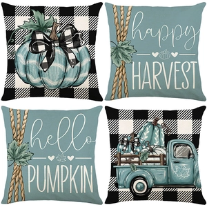 Lot de quatre housses de coussin d'automne avec citrouilles turquoise et carreaux noirs