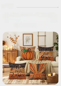 Detail of four autumn cushion covers featuring pumpkin prints and fall foliage on a sofa