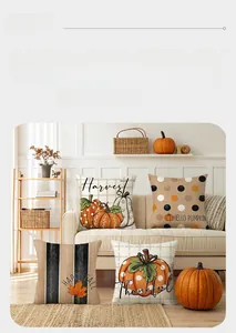 Detail of four fall pumpkin pillow covers with hand-drawn maple leaves on sofa