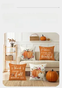 Detail of four autumn harvest pillow covers with pumpkins and maple leaves on a sofa