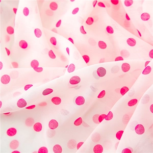 Polka dot chiffon fabric in light pink with airy texture and soft drapes