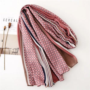 Close-up of retro floral and striped cotton linen scarf with soft fringe texture