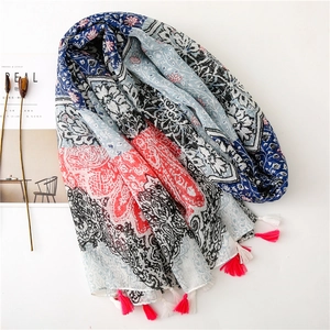 Floral paisley shawl with pink fringe tassels and bohemian patterns in navy and red
