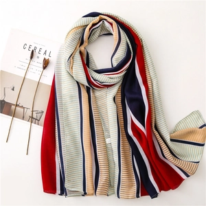 Lightweight striped scarf in red and navy blue with a soft chiffon texture and fringe