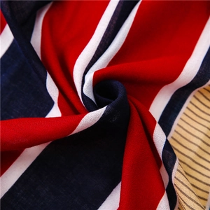 Macro shot of colorful striped lightweight fabric showing soft texture and weave