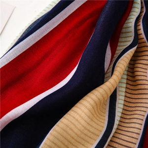 Detail shot of multi-colored striped fabric texture with fine weave for summer scarf