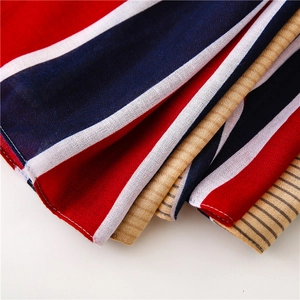 Detail shot of navy, red and white striped chiffon fabric with soft texture and drape