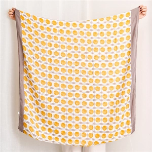 Detailed view of extra large yellow and grey geometric dot patterned cotton linen shawl