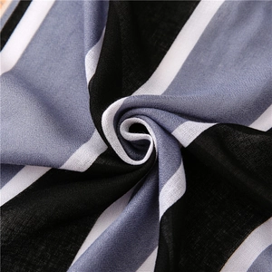 Detailed texture of soft striped fabric in black, white, and grey-blue tones