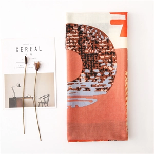 Artistic abstract pixel pattern scarf in warm reddish brown and beige tones
