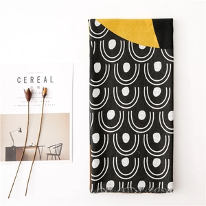 Minimalist scarf with black and yellow geometric U-shape patterns and fringe edges