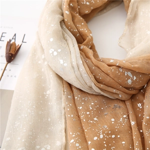 Beige to caramel gradient linen scarf with silver foil dots shown on white background