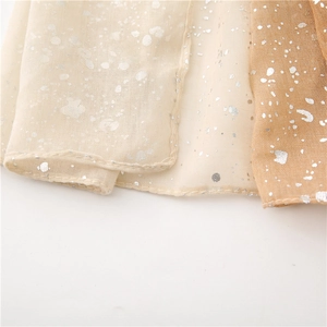 Close-up of lightweight cotton linen scarf with silver foil gradient and hemmed edges