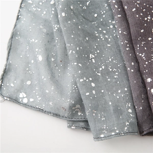 Detail of cotton linen scarf showing silver foil print texture and fine stitched edges