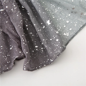 Detail of gradient cotton linen scarf with silver foil starry pattern texture