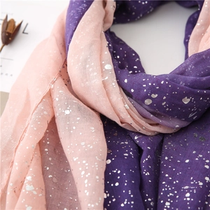 Detail of light pink and purple scarf with gradient silver foil speckles texture