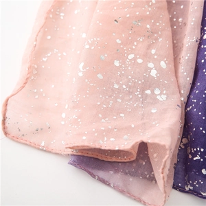 Detail of soft cotton linen scarf with gradient color and silver foil sparkles