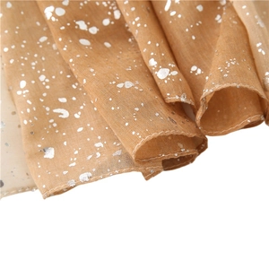 Lightweight khaki scarf with silver foil gradient pattern and refined rolled edges