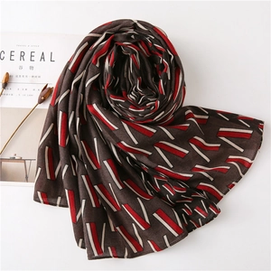 Elegant lightweight scarf with dark coffee geometric patterns and soft draping style