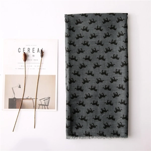 Grey cotton linen scarf featuring black horse patterns and delicate fringe edges