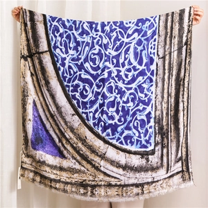 Detail of artistic cotton linen shawl showing damask patterns and natural fringe edges