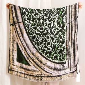 Close-up of geometric pattern and fine fringe on cotton linen vintage shawl