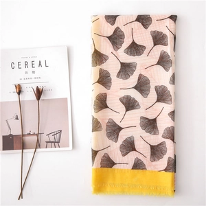 Bohemian floral scarf with pink ginkgo leaf pattern and yellow fringe borders