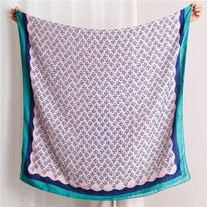 Detailed full-spread of cotton linen scarf with plum blossom and geometric patterns