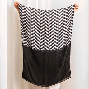 Detail of herringbone print scarf with lightweight black chiffon splice finish