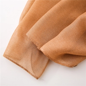 Macro detail of ochre textured fabric with precision stitching and fine weave