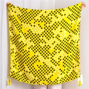 Detail of yellow honeycomb pattern cotton linen scarf with elegant corner tassels