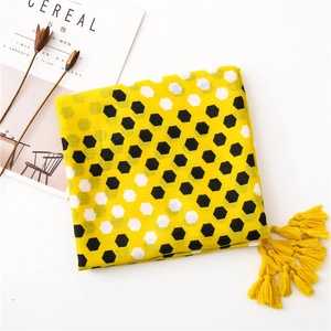 Detailed view of yellow honeycomb cotton linen scarf with soft fringe and stylish prints