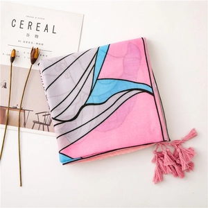 Detail of geometric pattern scarf with pink tassels and breathable cotton linen texture