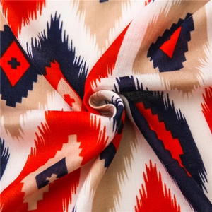Fashionable red and blue geometric print scarf with bohemian patterns and fringe detail