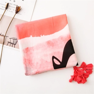 Detail of pink cotton linen scarf with red fringe tassels and artistic watercolor print