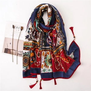 Bohemian paisley linen scarf with handmade wooden beads and tassels on a white background