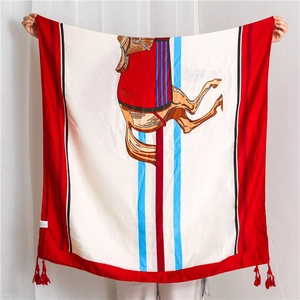 Close-up of linen-cotton scarf with red and blue stripes and horse print and tassels