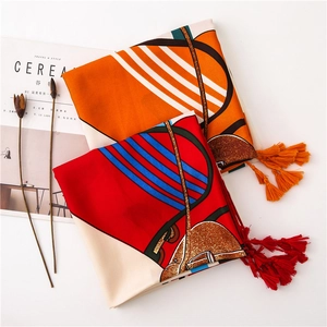 Elegant cotton linen scarf with horse bridle print and fringe on minimal white background