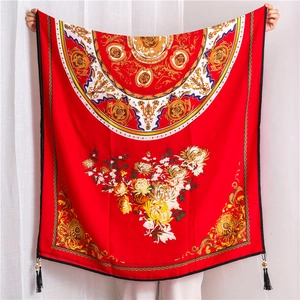 Detail of red floral cotton linen scarf with peony print and wooden bead tassels