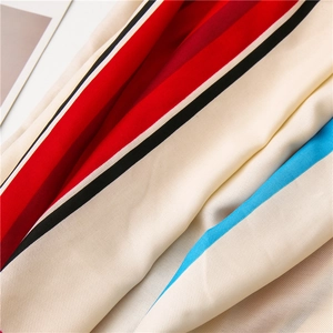 Detail of striped cotton linen scarf showing soft twill texture and vibrant color pattern